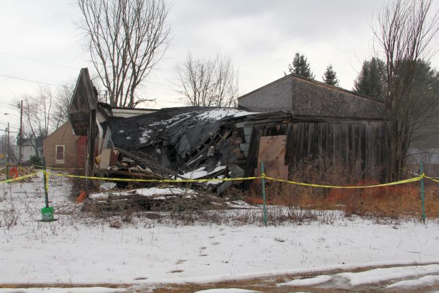 Ernie's garage roof collapsed but walls still standing