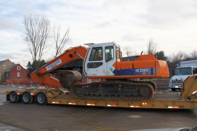 Ernie's garage - backhoe with thumb ready to start work