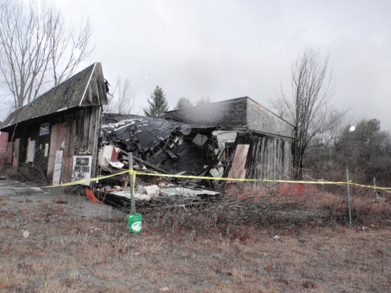 Side view of Ernie's garage with collapsed wall