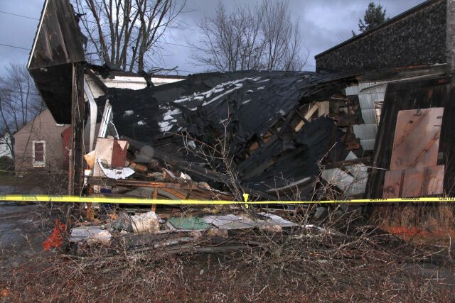 What's left of the tree that held up the wall at Ernie's