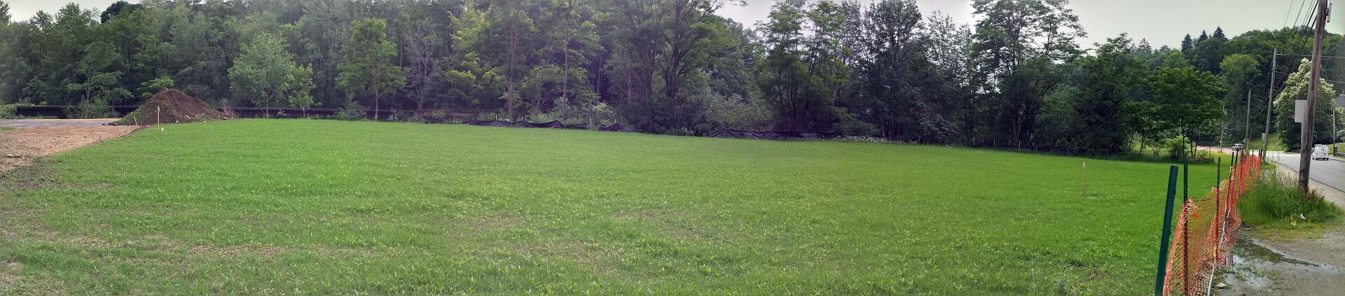 View of former Ernie's property with grass and snow fence